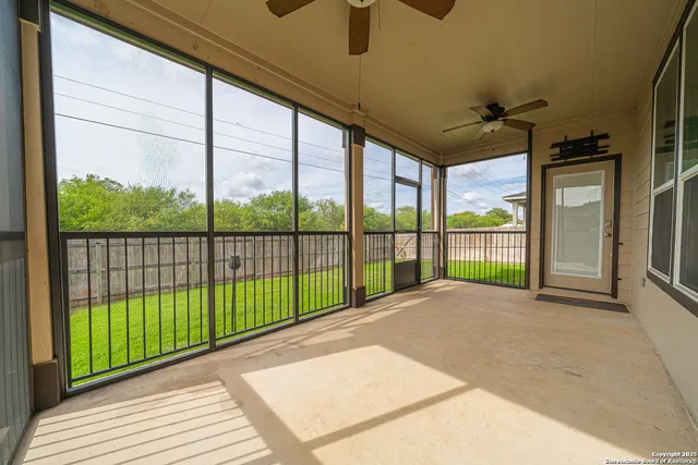 a view of a backyard with a garden and entertaining space