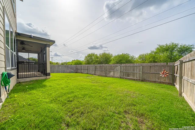 a view of a deck with a floor to ceiling window