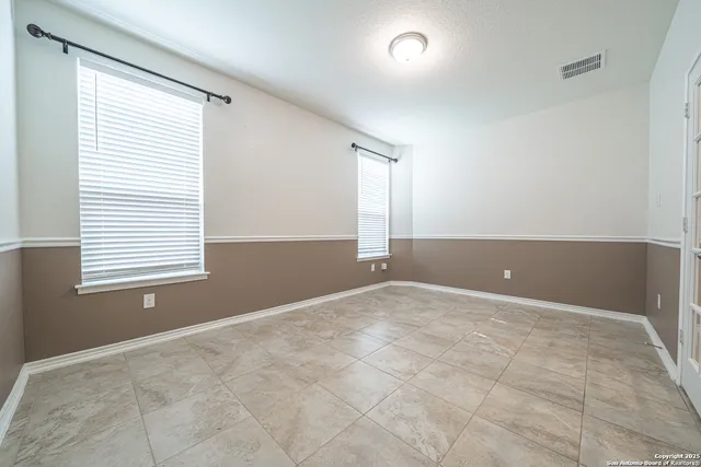 an empty room with windows