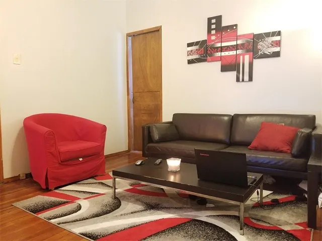 a living room with furniture and a couch