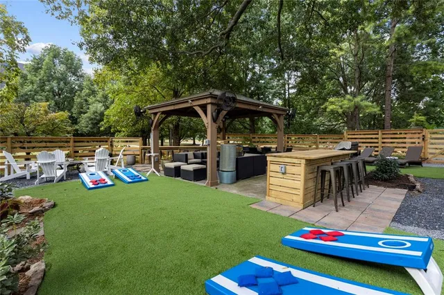 a balcony with table and chairs