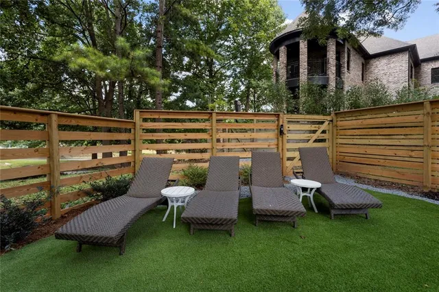 a view of a kitchen with stainless steel appliances and stove