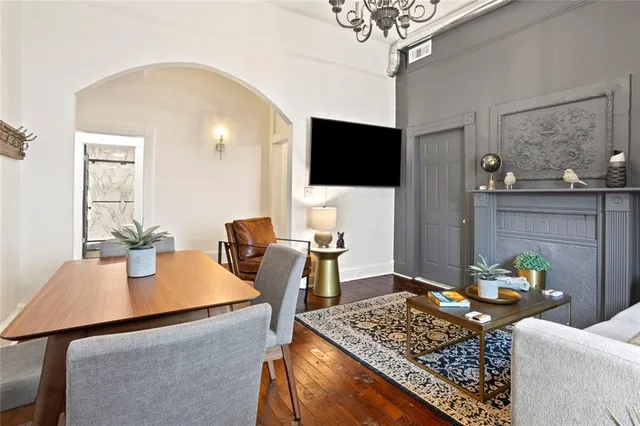 a kitchen with stainless steel appliances granite countertop a sink a stove and a refrigerator