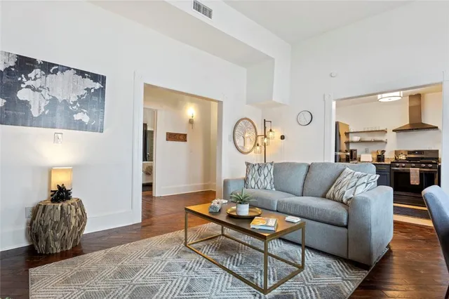 a kitchen with stainless steel appliances granite countertop a sink stove and cabinets
