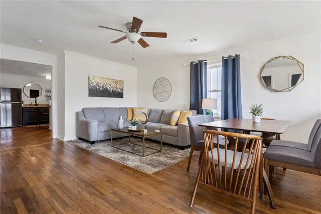 a kitchen with a sink cabinets and wooden floor