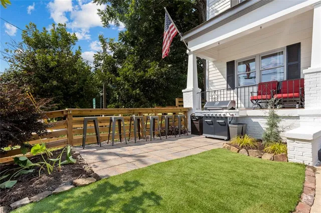 a kitchen with a stove a sink and a refrigerator