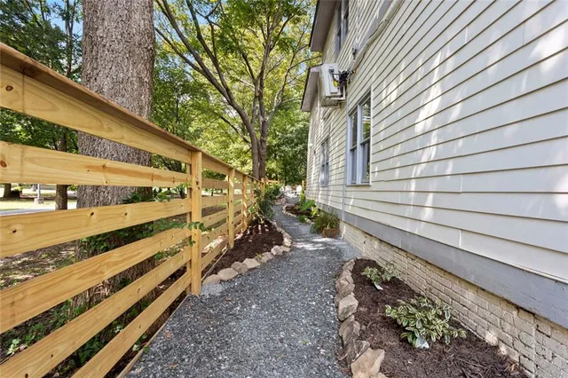 a view of house with backyard and garden
