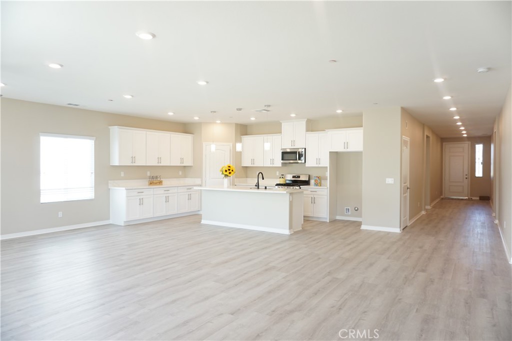 128 Chumash Perris, CA 92570 - Photo 11 of 22 a view of kitchen with wooden floor