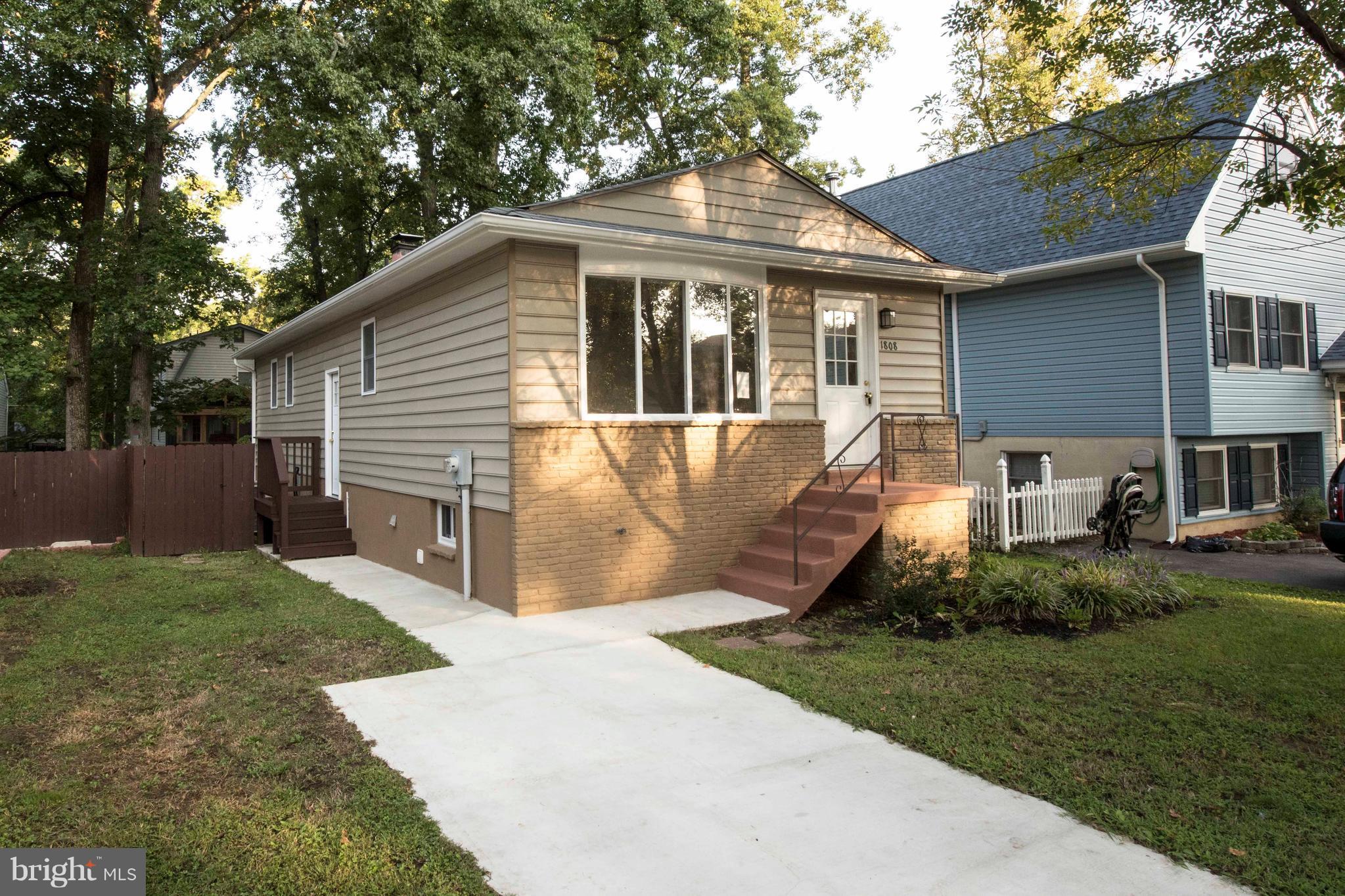 1808 Glenarm Road Edgewater, MD 21037 - Photo 2 of 29 a front view of a house with yard and green space