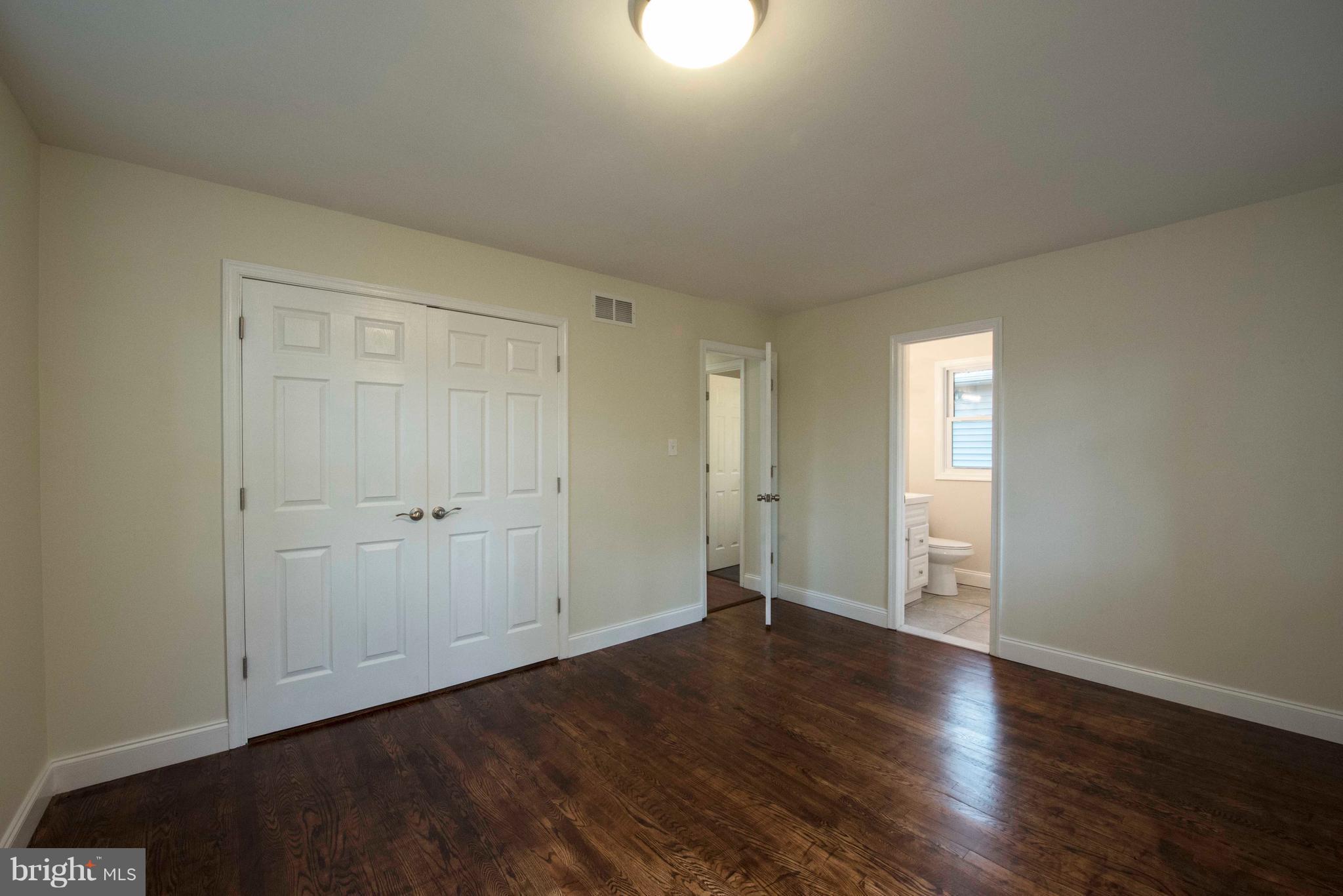 1808 Glenarm Road Edgewater, MD 21037 - Photo 12 of 29 a view of a room with wooden floor and white walls