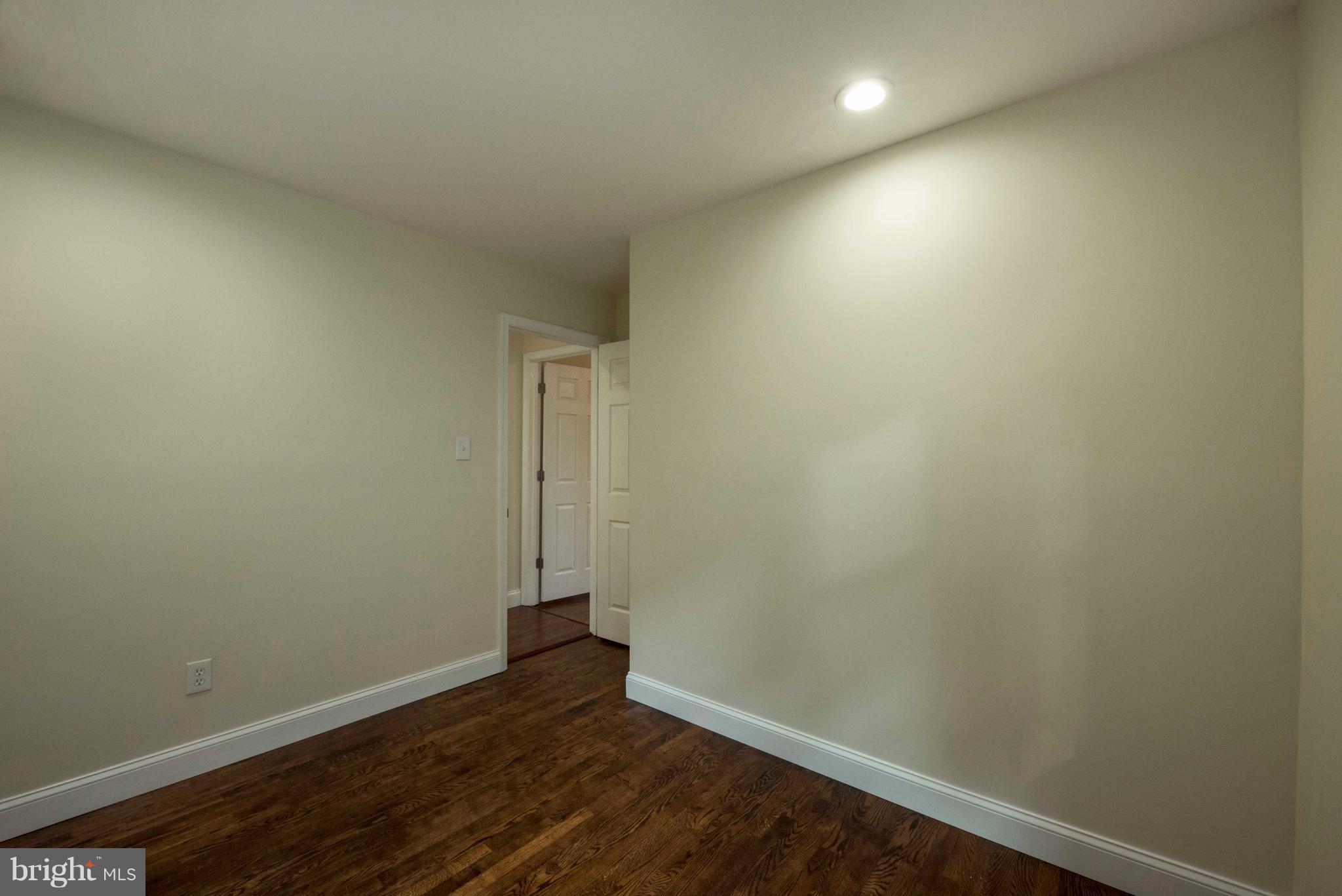 1808 Glenarm Road Edgewater, MD 21037 - Photo 17 of 29 an empty room with wooden floor and windows