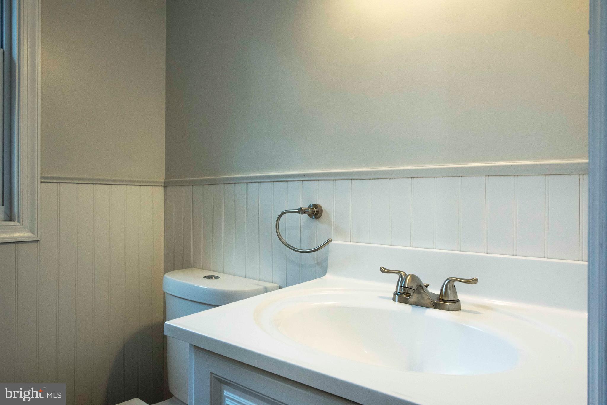 1808 Glenarm Road Edgewater, MD 21037 - Photo 18 of 29 a bathroom with a sink and a toilet