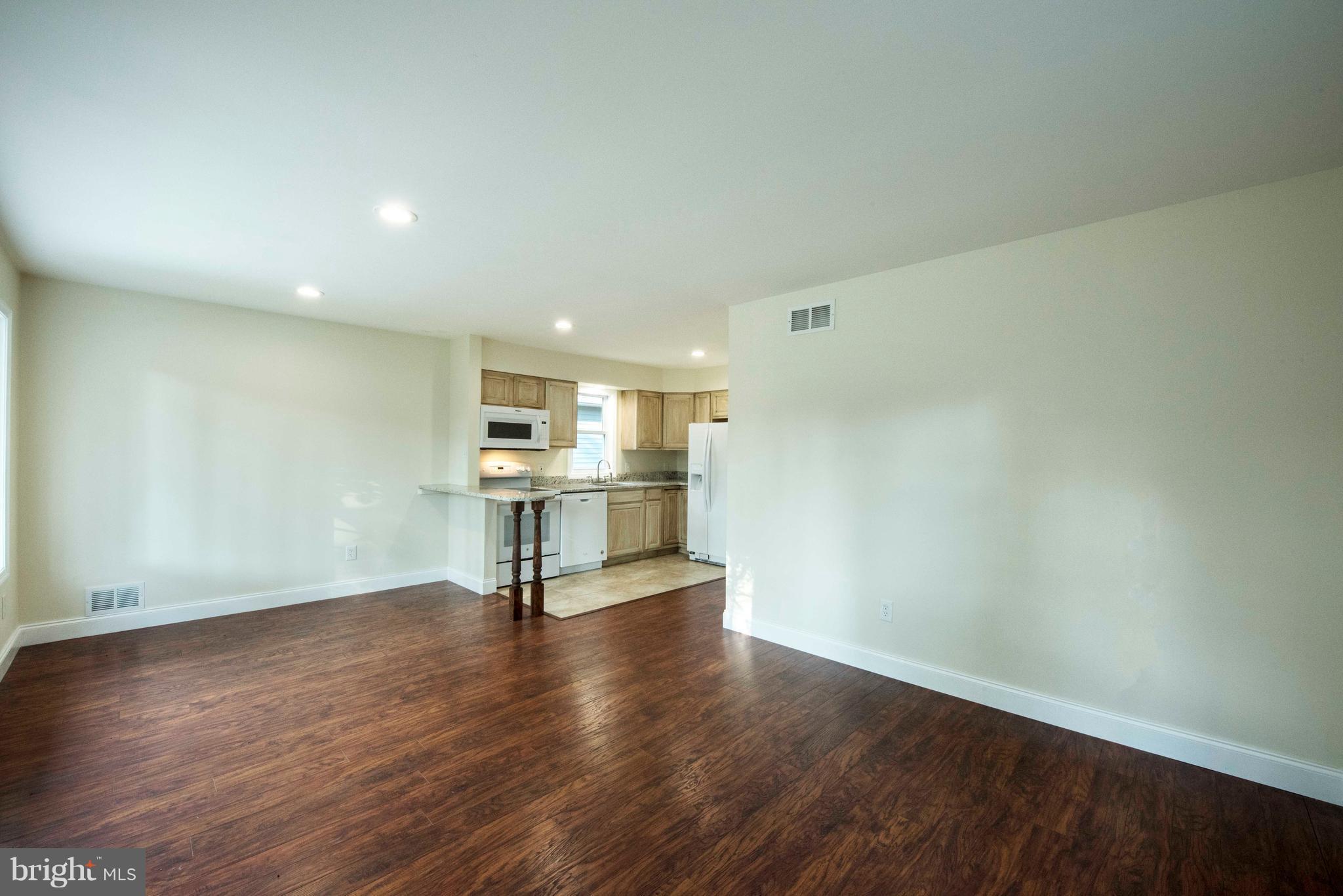 1808 Glenarm Road Edgewater, MD 21037 - Photo 4 of 29 a view of a room with wooden floor table and chairs