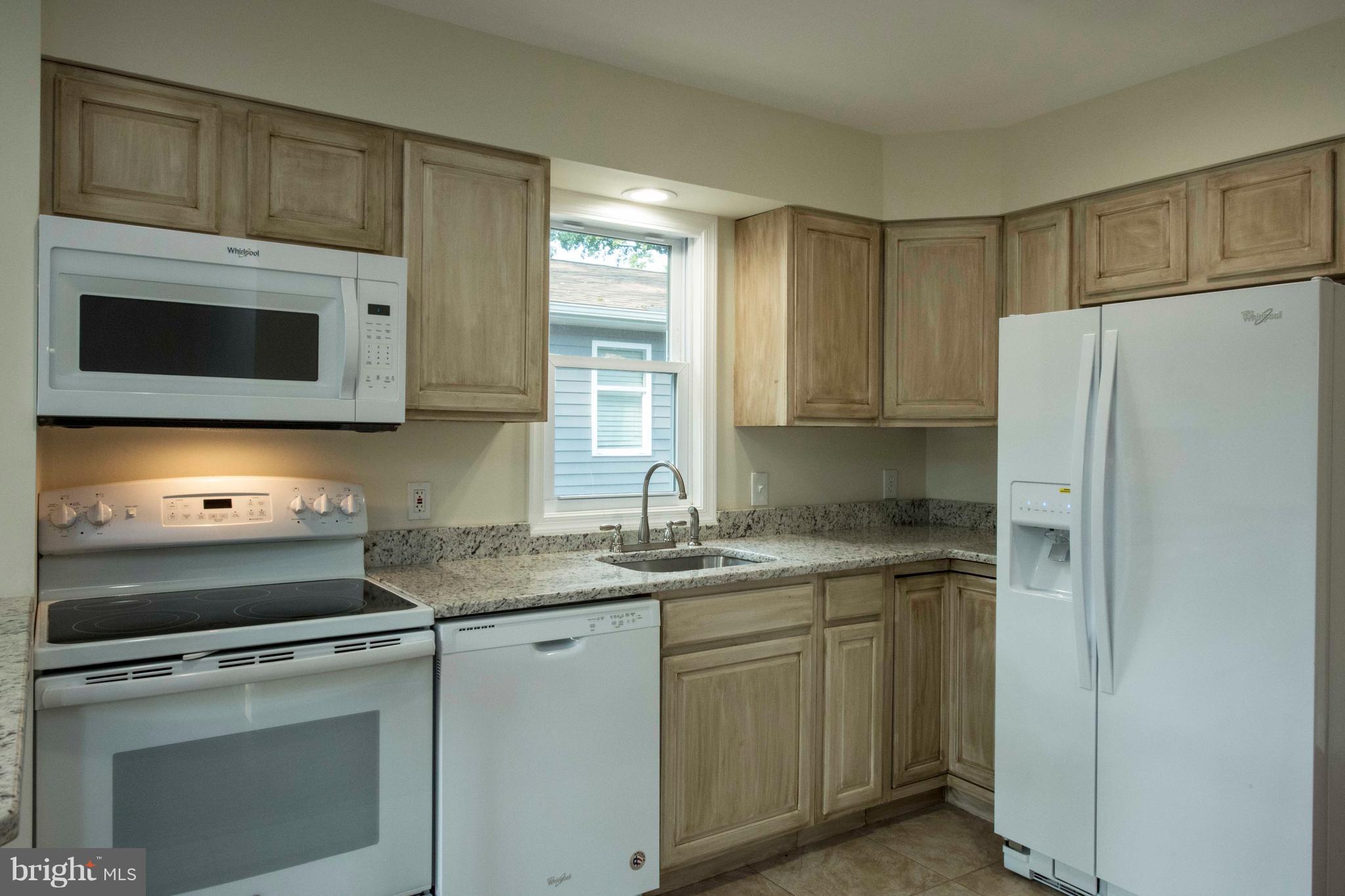 1808 Glenarm Road Edgewater, MD 21037 - Photo 8 of 29 a kitchen with a sink stove and microwave