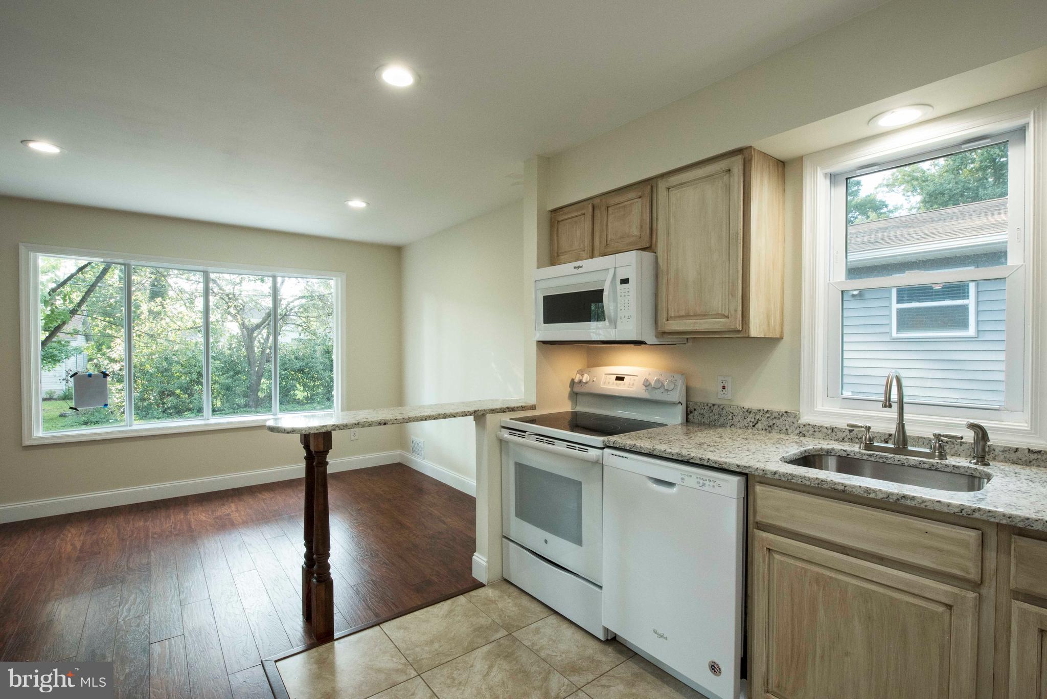 1808 Glenarm Road Edgewater, MD 21037 - Photo 10 of 29 a kitchen with a sink stove and microwave