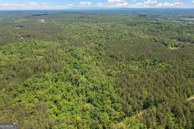 a view of a field with an outdoor space