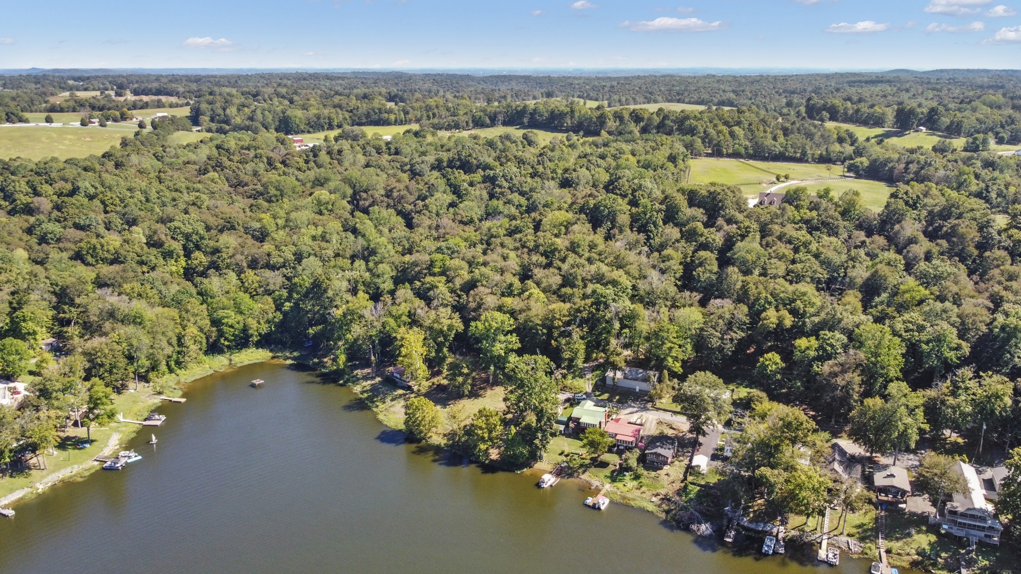 294 Cherokee Boat Dock Road Lewisburg, KY 42256 - Photo 14 of 21 an aerial view of a city with lots of residential buildings and mountain view in back