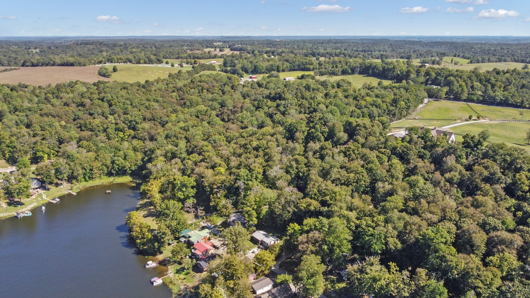 294 Cherokee Boat Dock Road Lewisburg, KY 42256 - Photo 15 of 21 a view of a lake with a city