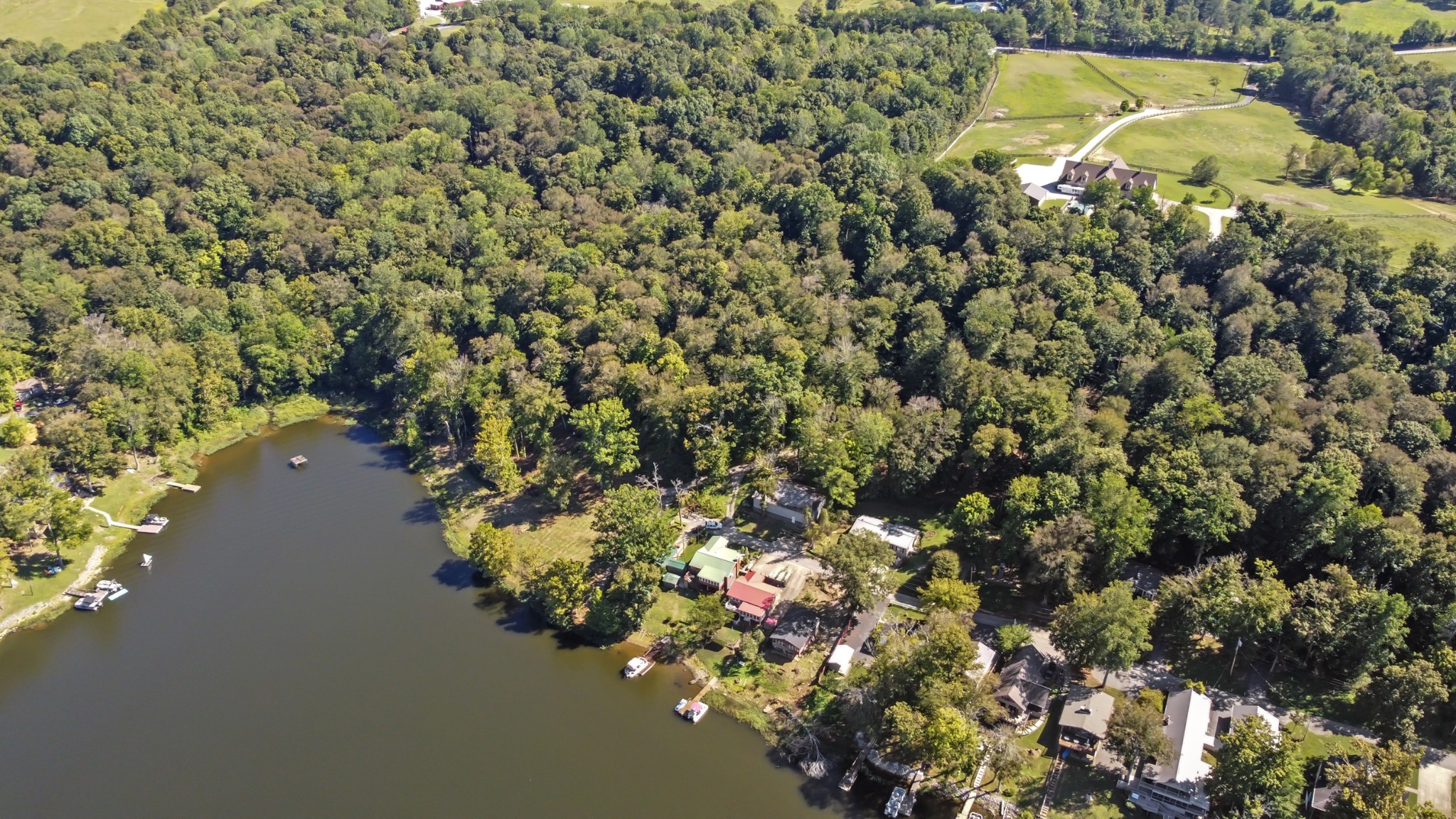 294 Cherokee Boat Dock Road Lewisburg, KY 42256 - Photo 8 of 21 a view of a lake with a building