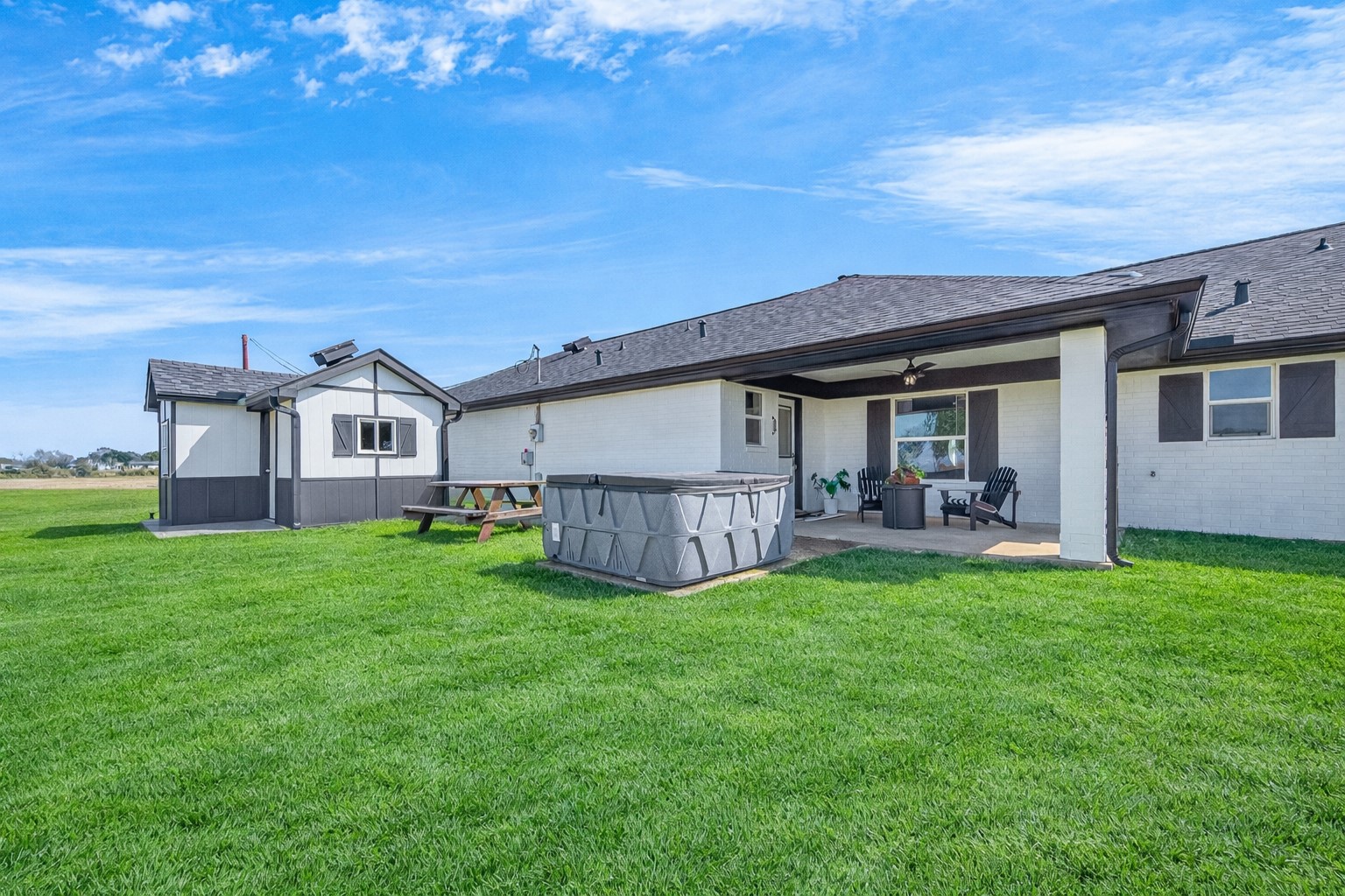10550 Brinkmeyer Road Needville, TX 77461 - Photo 2 of 40 Large Well house behind the home as well as hot tub on concrete