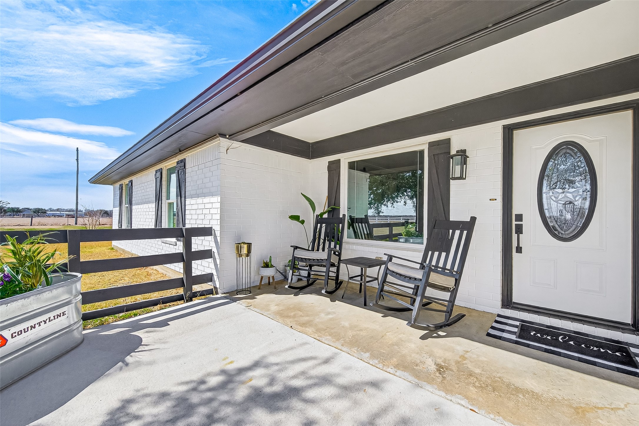 10550 Brinkmeyer Road Needville, TX 77461 - Photo 7 of 40 Extended concrete front porch