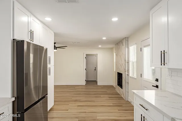 a bathroom with a double vanity sink and a large mirror