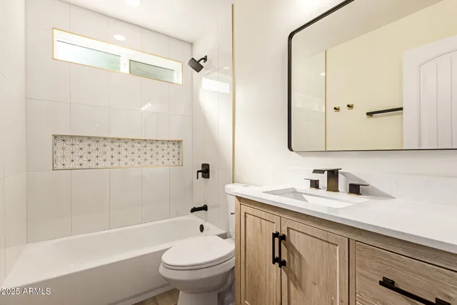 a bathroom with a sink a toilet and a bathtub