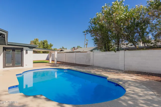 a swimming pool with an outdoor space