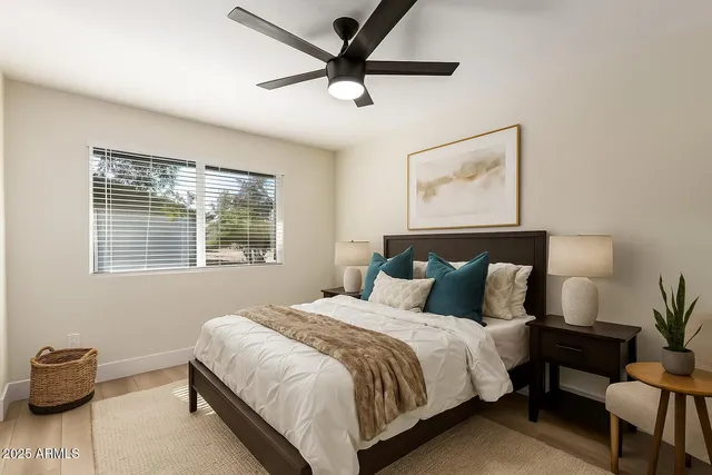 a bedroom with bed and a window