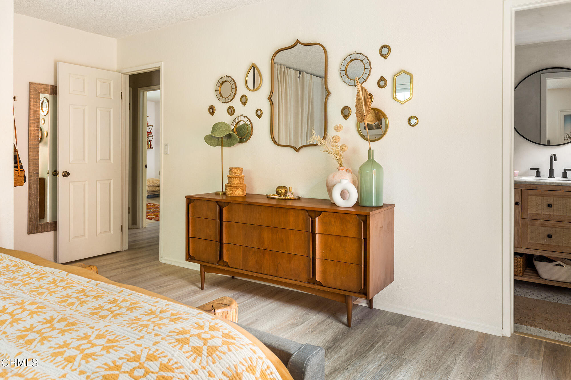9704 Hillhaven Avenue Tujunga, CA 91042 - Photo 16 of 24 a bedroom with a bed and wooden floor