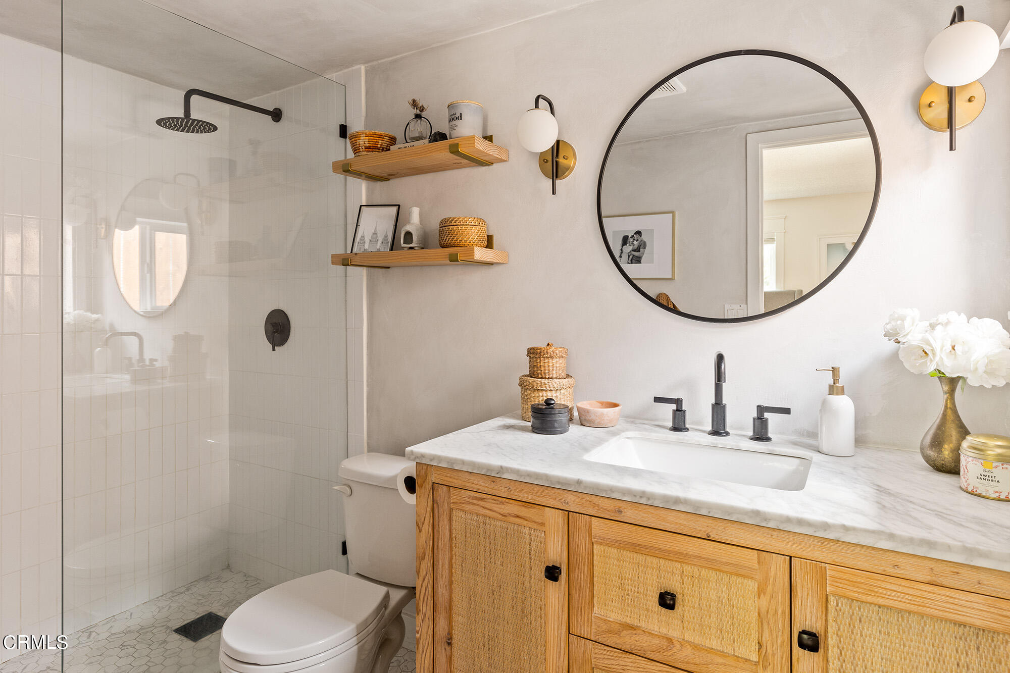 9704 Hillhaven Avenue Tujunga, CA 91042 - Photo 17 of 24 a bathroom with a granite countertop toilet sink and mirror