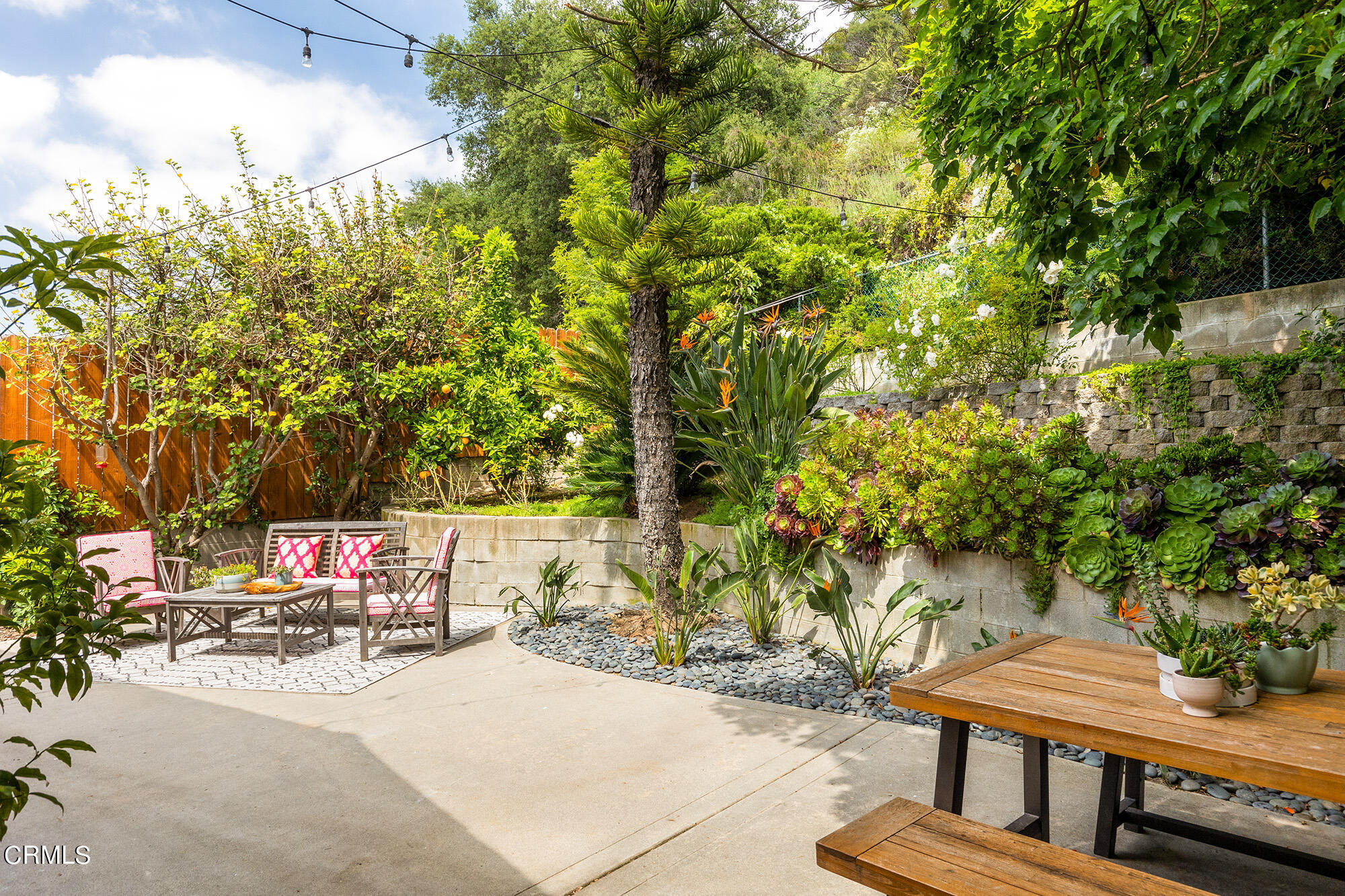 9704 Hillhaven Avenue Tujunga, CA 91042 - Photo 21 of 24 a view of a patio with table and chairs and potted plants
