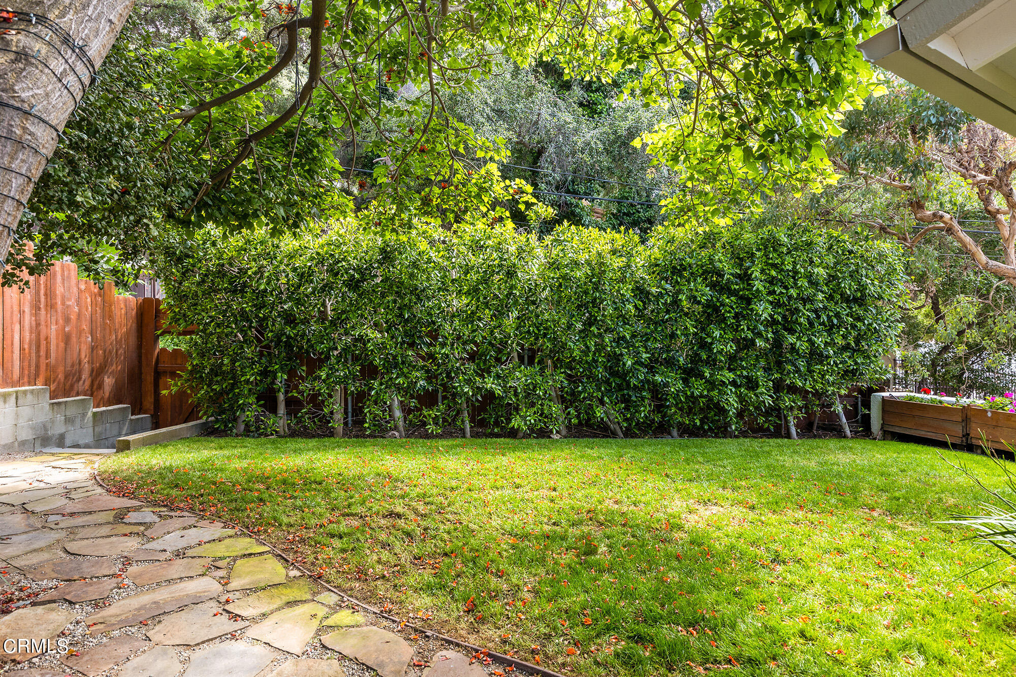 9704 Hillhaven Avenue Tujunga, CA 91042 - Photo 24 of 24 a view of a garden with a bench