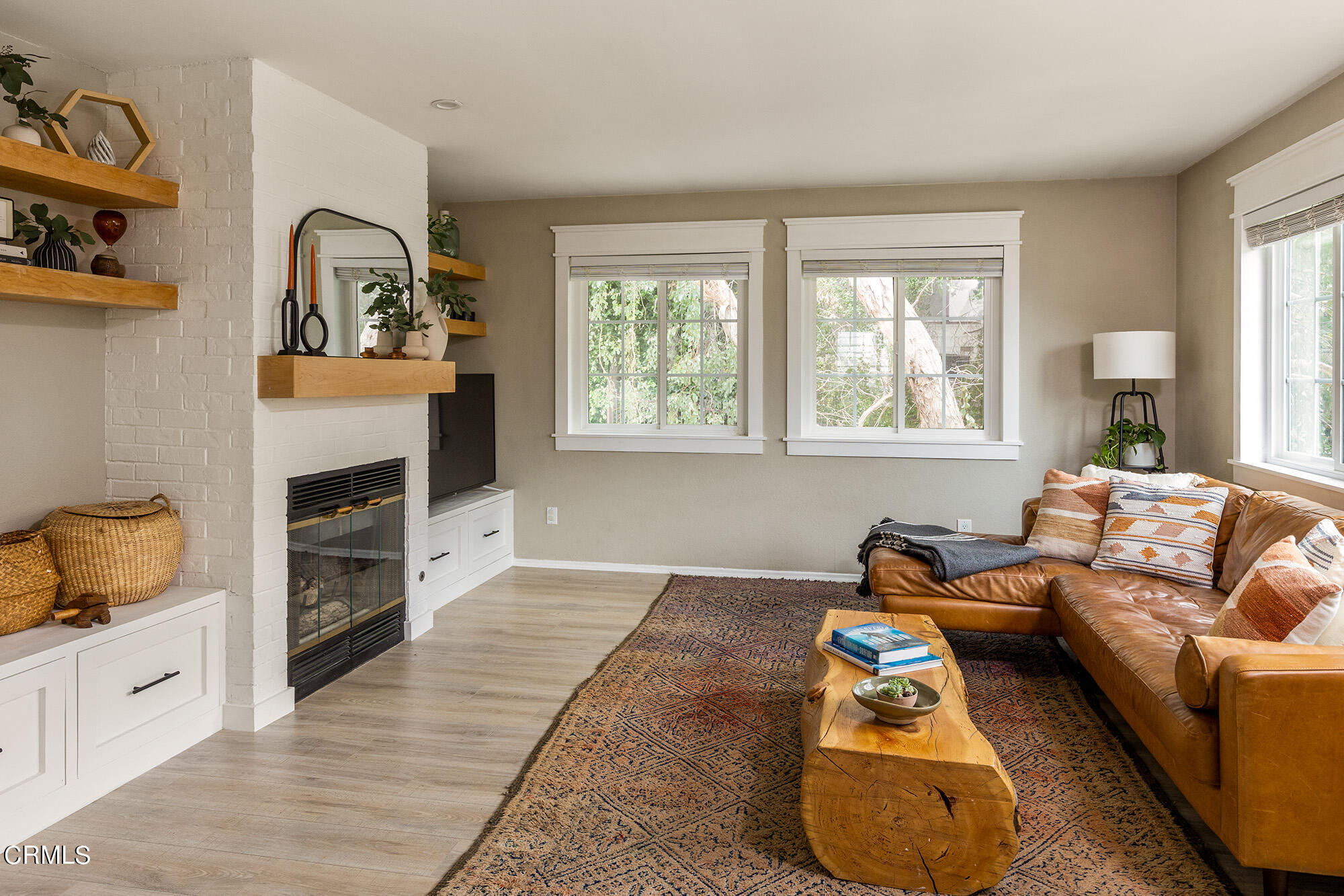 9704 Hillhaven Avenue Tujunga, CA 91042 - Photo 6 of 24 a living room with furniture and a fireplace