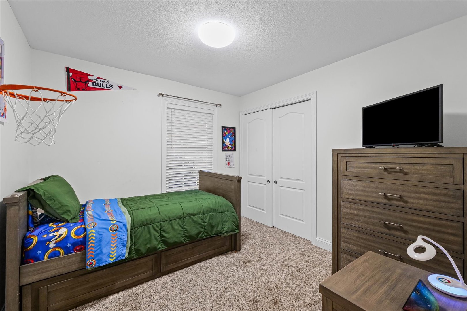 1713 Hunters Ridge Court Mahomet, IL 61853 - Photo 14 of 30 a living room with furniture and a flat screen tv