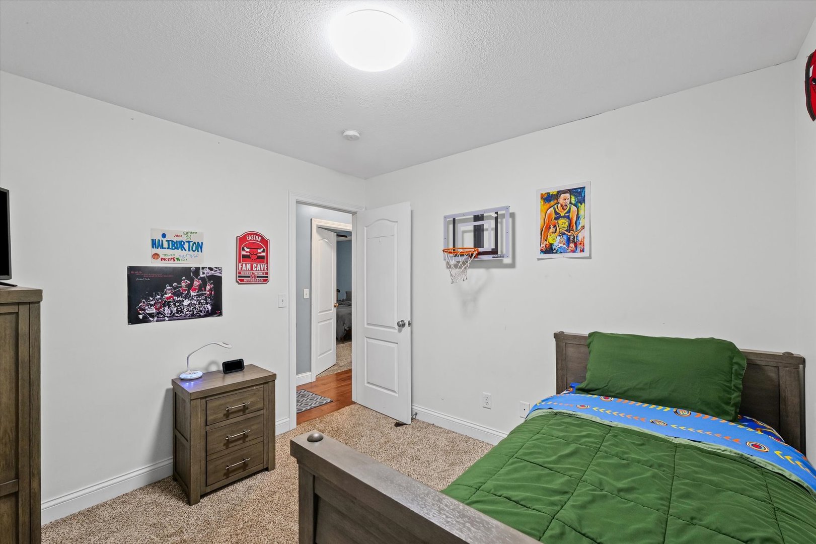 1713 Hunters Ridge Court Mahomet, IL 61853 - Photo 15 of 30 a bedroom with a bed and cabinets