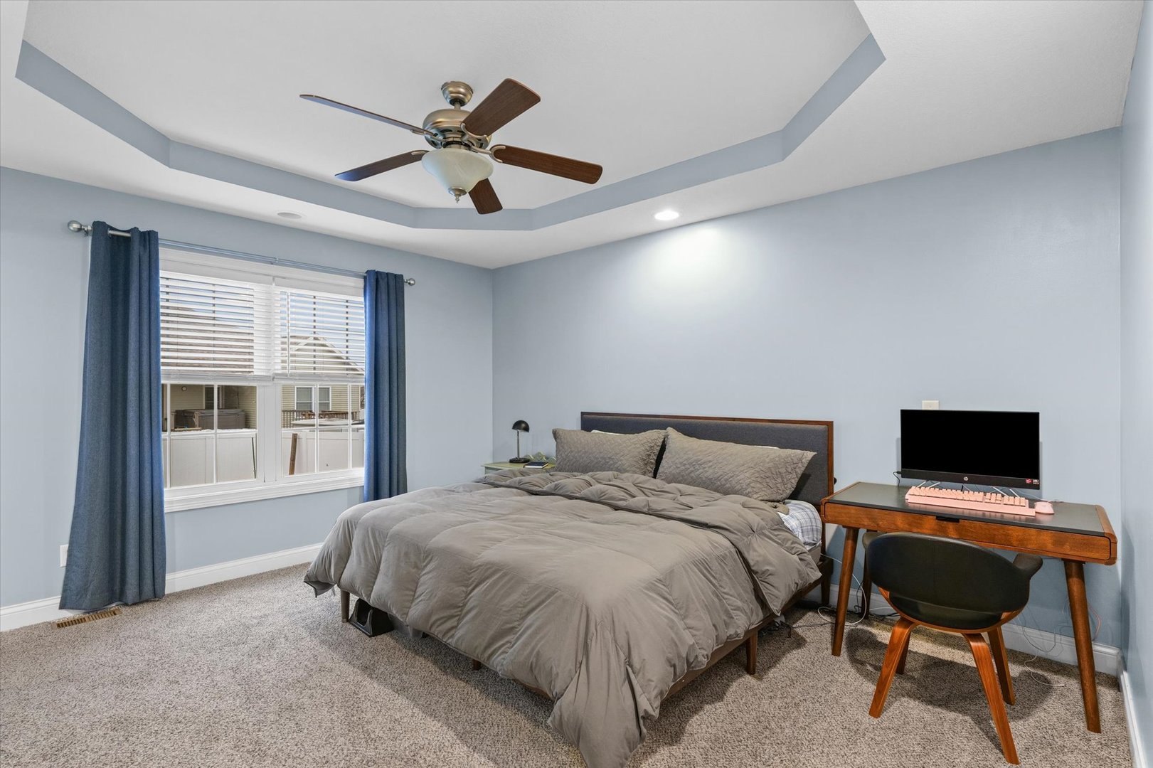 1713 Hunters Ridge Court Mahomet, IL 61853 - Photo 19 of 30 a bedroom with a bed and a desk