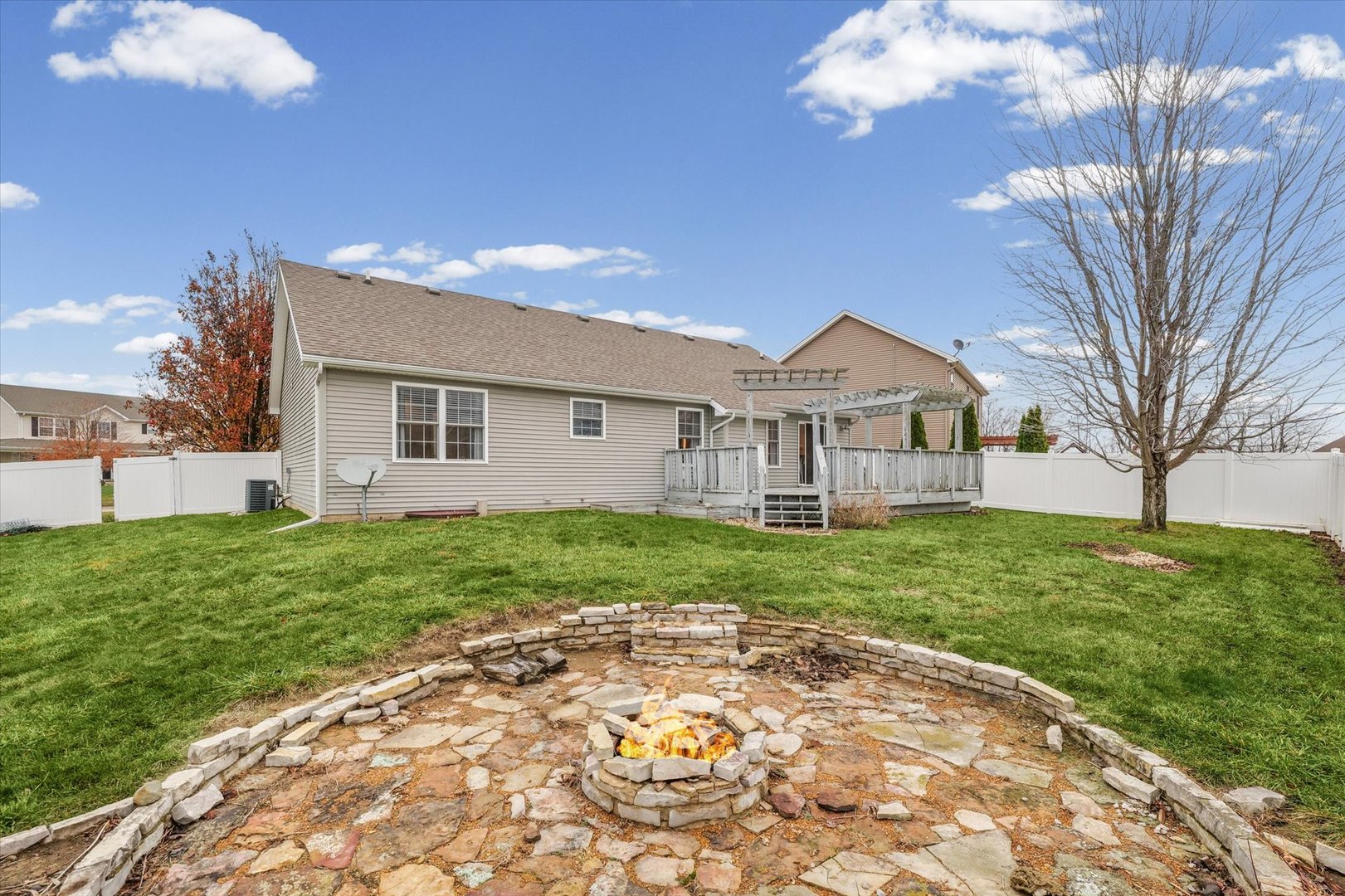 1713 Hunters Ridge Court Mahomet, IL 61853 - Photo 26 of 30 a view of a house with a backyard