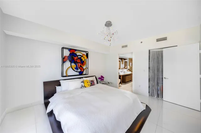 a bedroom with a bed next to a window with the outer view