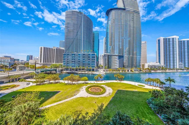 a swimming pool with outdoor seating and yard