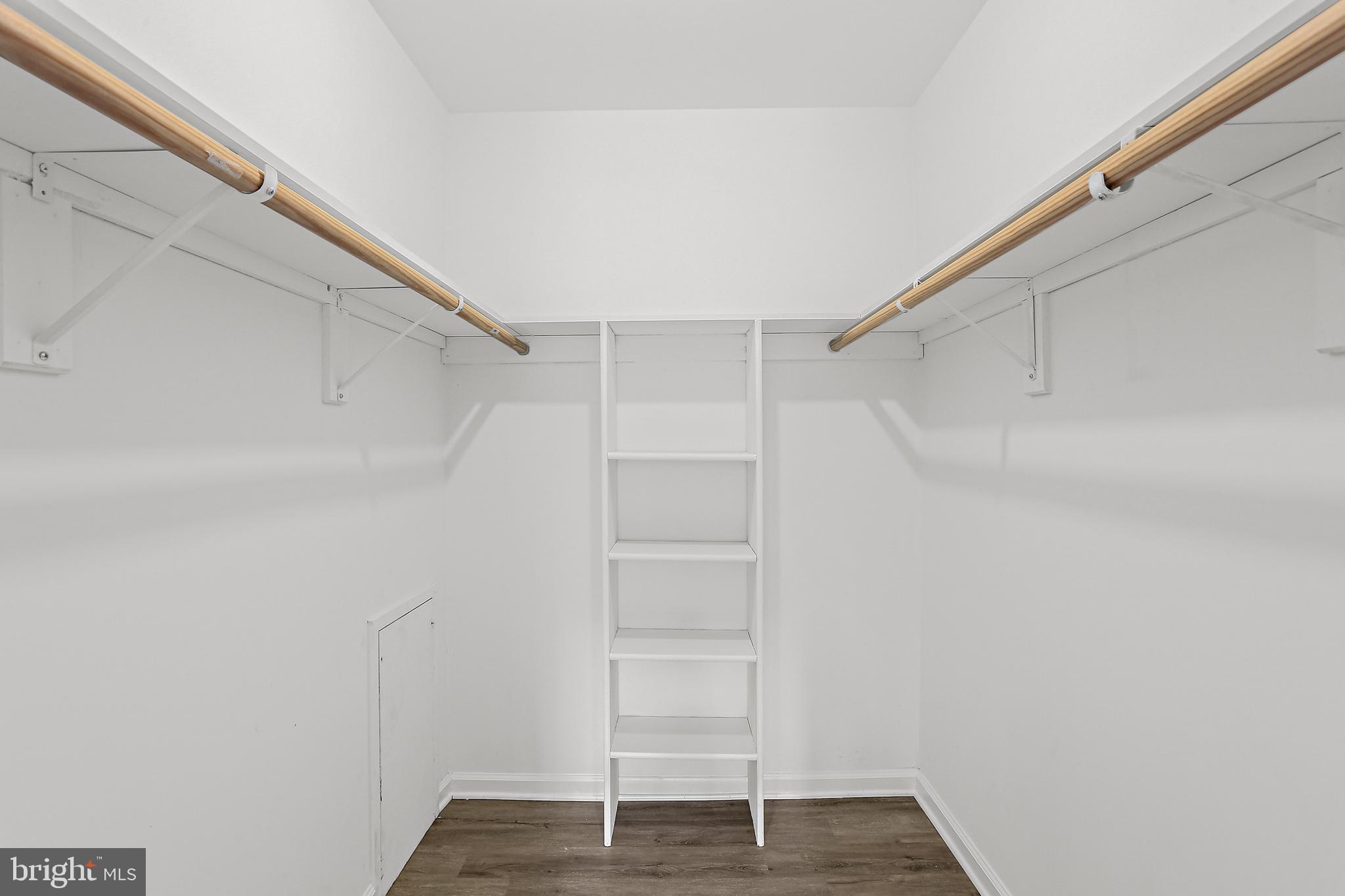9629 White Acre Road, Unit B2 Columbia, MD 21045 - Photo 9 of 11 a view of walk in closet with empty racks