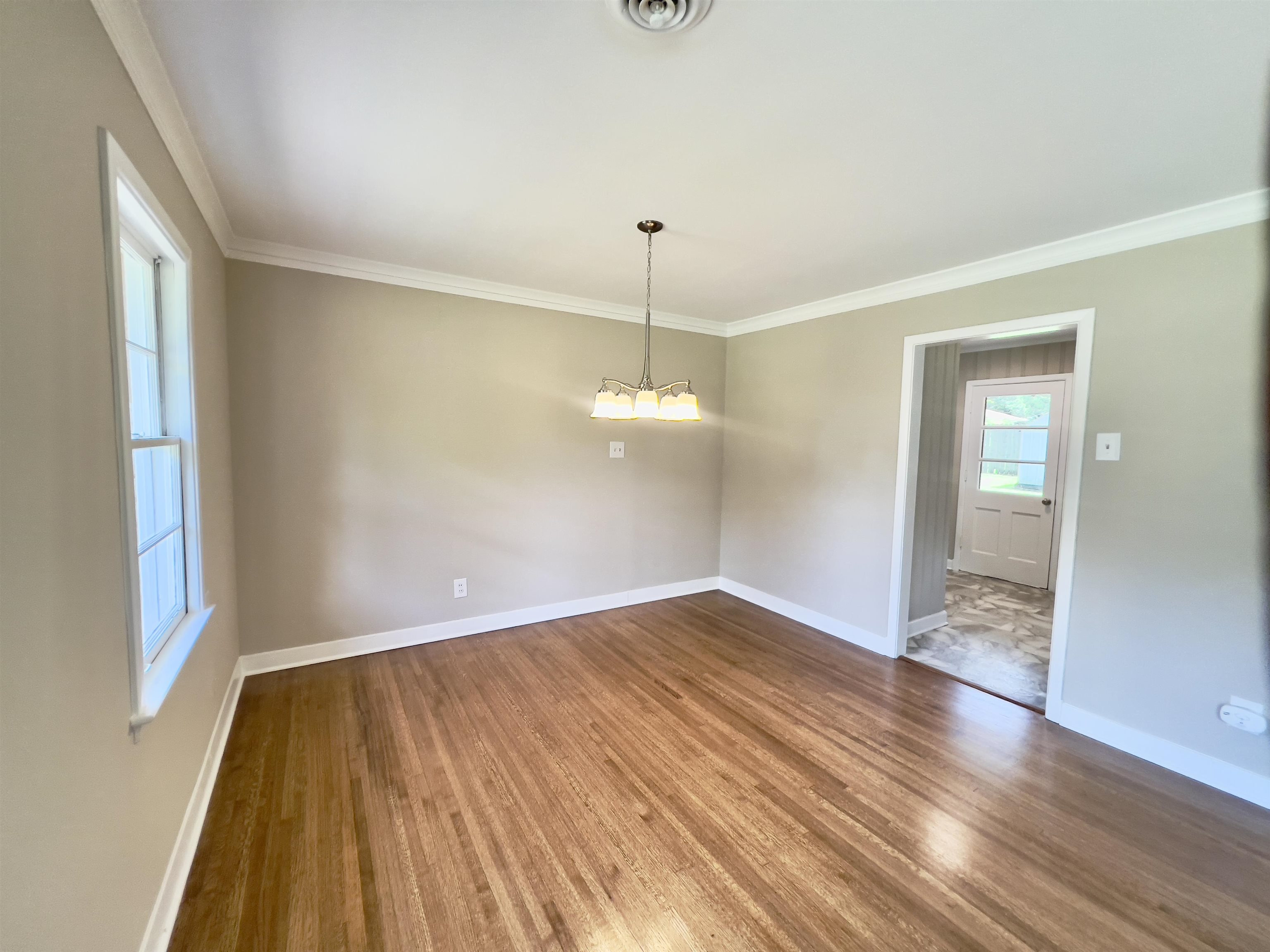 167 Clower Road Memphis, TN 38109 - Photo 3 of 20 a view of a room with wooden floor and window