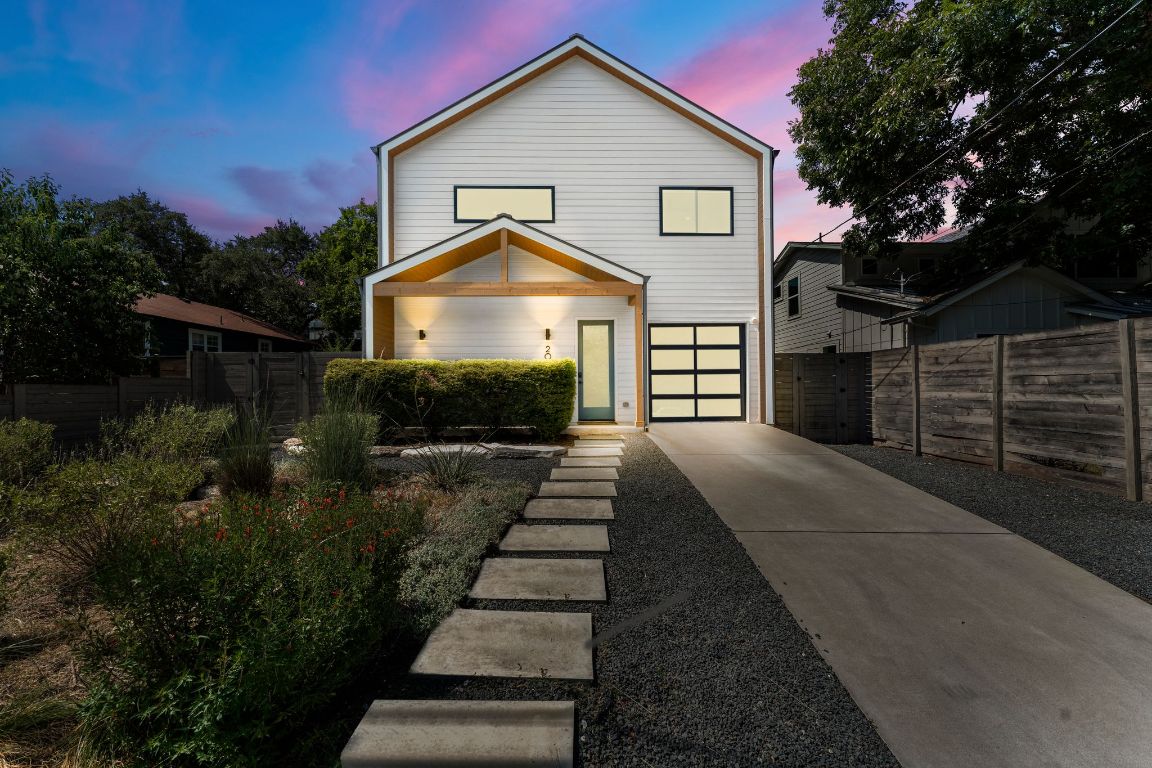 205 Ben Howell Drive Austin, TX 78704 - Photo 1 of 38 a front view of a house with a yard
