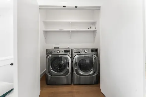 a utility room with washing machine