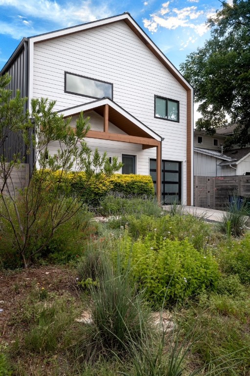 205 Ben Howell Drive Austin, TX 78704 - Photo 36 of 38 a front view of a house with garden