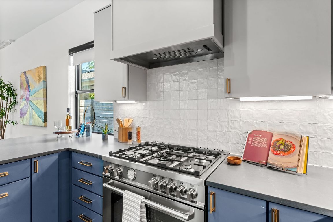 205 Ben Howell Drive Austin, TX 78704 - Photo 5 of 38 a stove top oven sitting inside of a kitchen