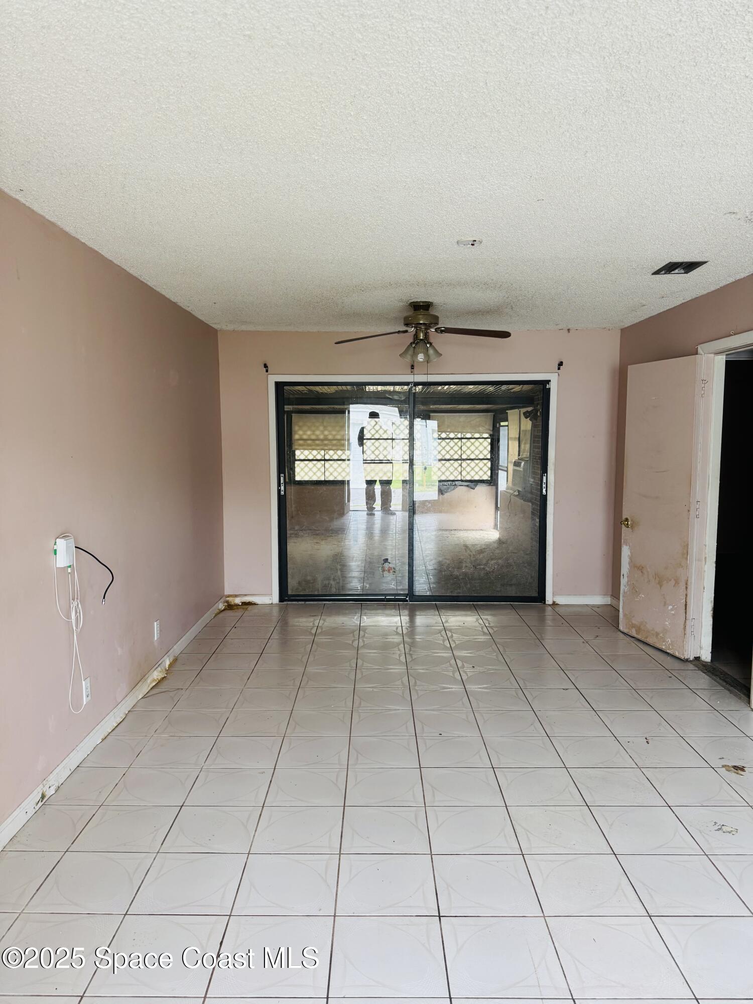 255 Abalone Road Northwest Palm Bay, FL 32907 - Photo 5 of 11 a view of an empty room and window