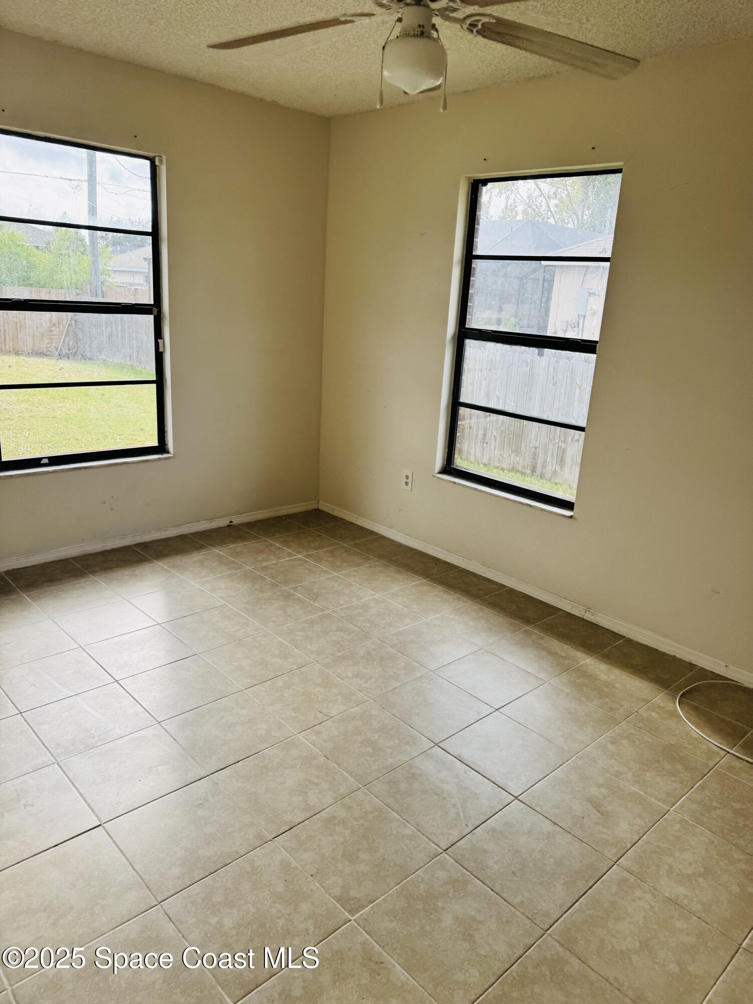 255 Abalone Road Northwest Palm Bay, FL 32907 - Photo 8 of 11 a view of a room with a window