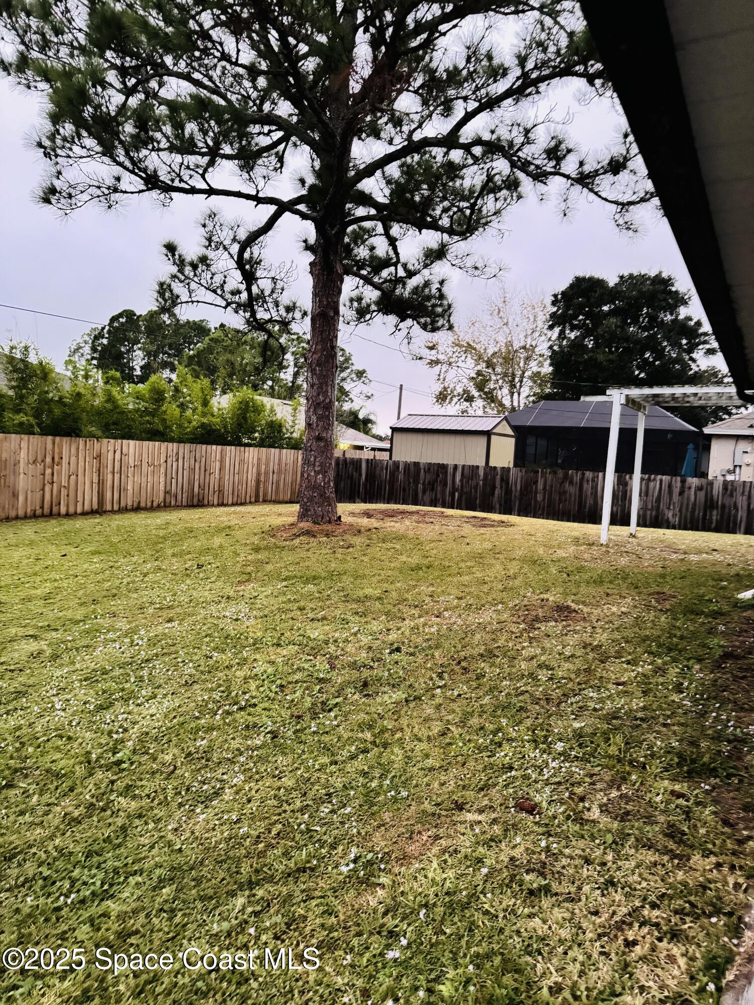 255 Abalone Road Northwest Palm Bay, FL 32907 - Photo 9 of 11 a view of a swimming pool with an outdoor space