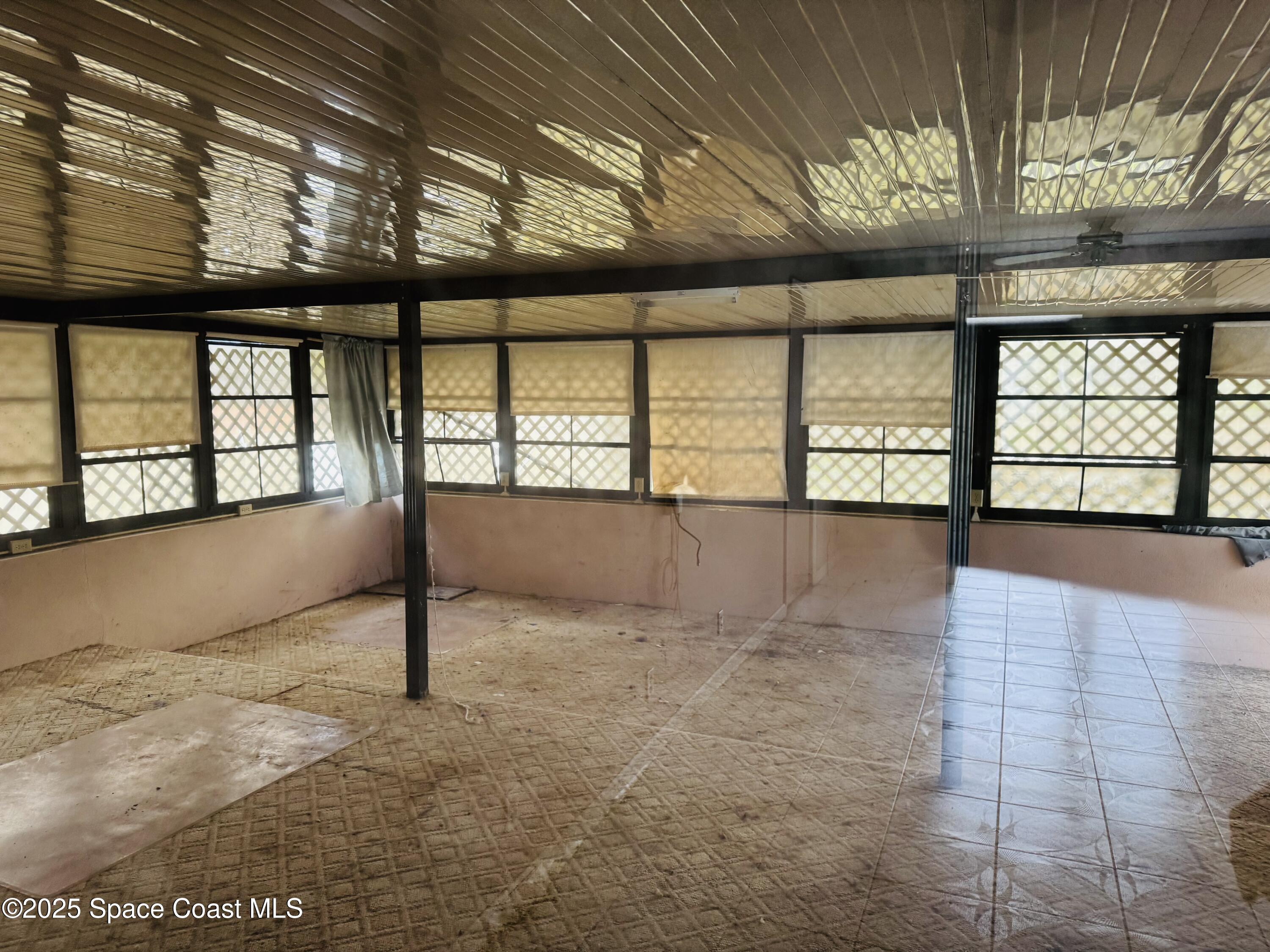 255 Abalone Road Northwest Palm Bay, FL 32907 - Photo 10 of 11 a view of an empty room with a window